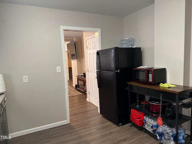 miscellaneous room with dark hardwood / wood-style flooring