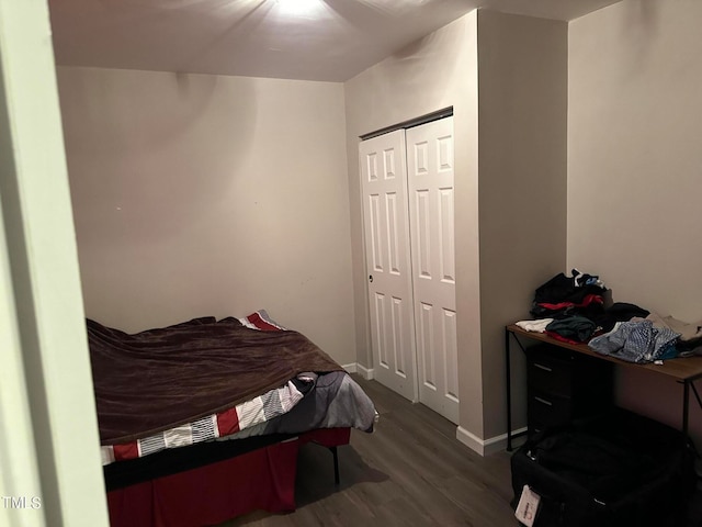 bedroom featuring hardwood / wood-style flooring and a closet