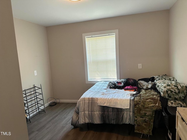 bedroom with hardwood / wood-style flooring