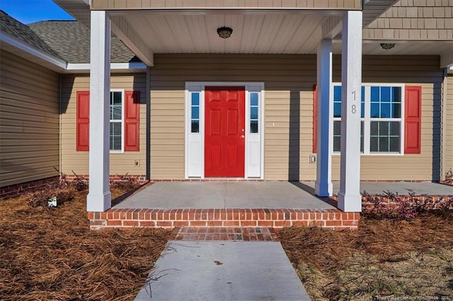 property entrance with covered porch