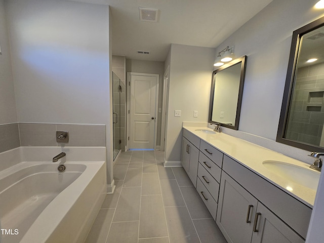 bathroom featuring tile patterned floors, plus walk in shower, and vanity