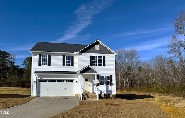 traditional-style house featuring driveway, a shingled roof, and an attached garage