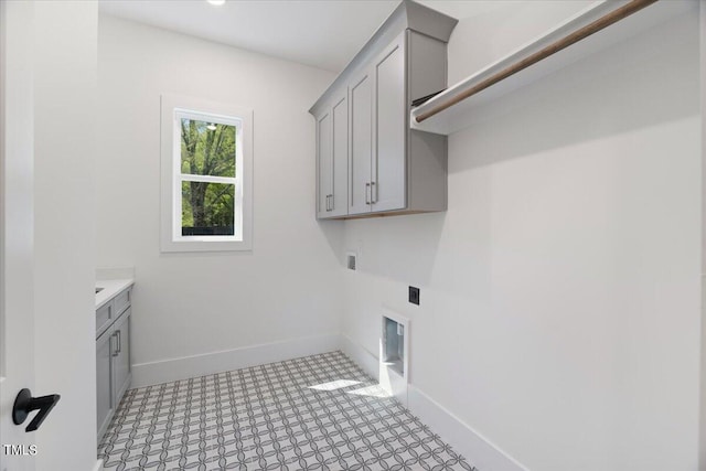 laundry room with hookup for a washing machine, cabinets, and hookup for an electric dryer