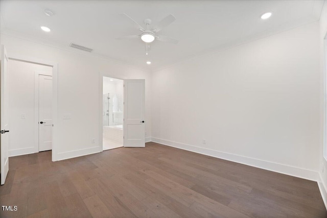 unfurnished bedroom featuring ceiling fan and dark hardwood / wood-style flooring