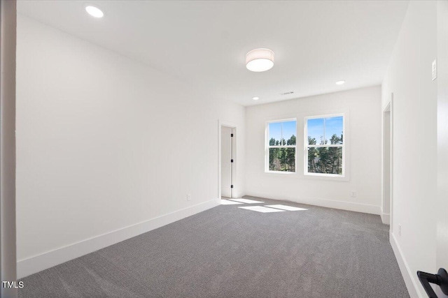 spare room featuring carpet flooring