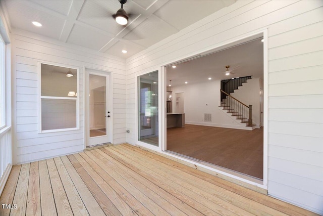 wooden terrace featuring ceiling fan