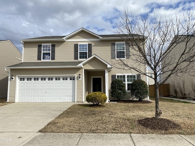 view of front of home with a garage and a front yard