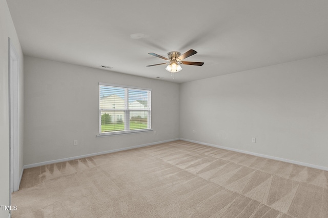 empty room with light carpet and ceiling fan