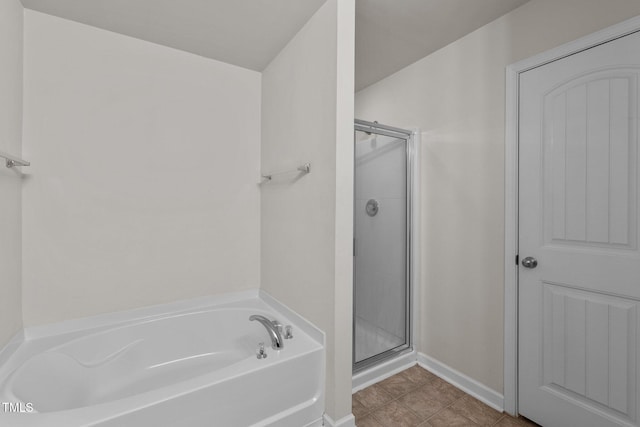 bathroom with separate shower and tub