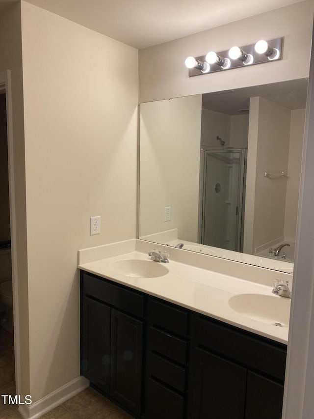 bathroom featuring tile patterned floors, independent shower and bath, and vanity