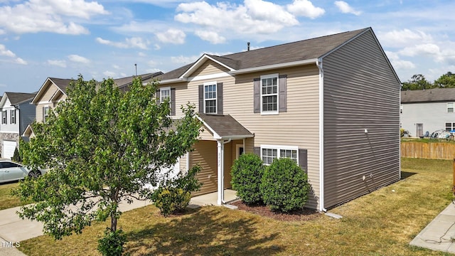 view of front of property featuring fence and a front yard