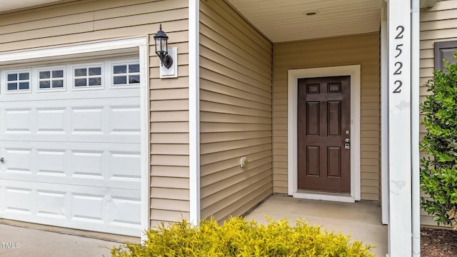 property entrance with a garage