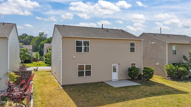 back of property featuring a patio, fence, and a yard