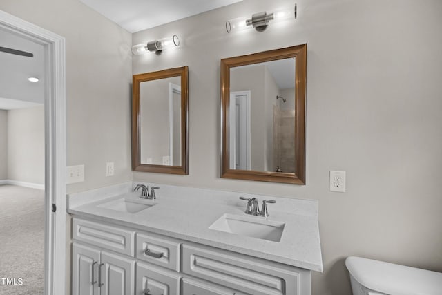 bathroom with toilet and vanity