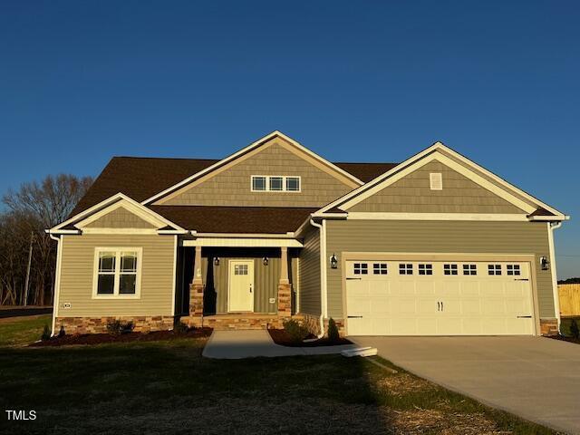 craftsman-style home with a garage