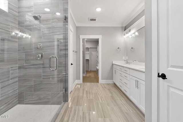 bathroom featuring vanity, toilet, and a shower with door