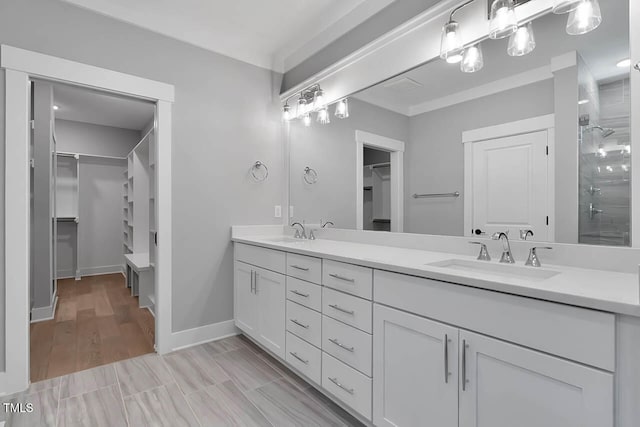 bathroom with vanity, hardwood / wood-style flooring, and walk in shower