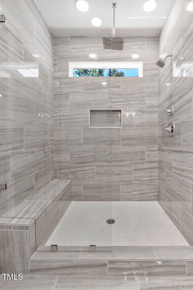 bathroom with tiled shower