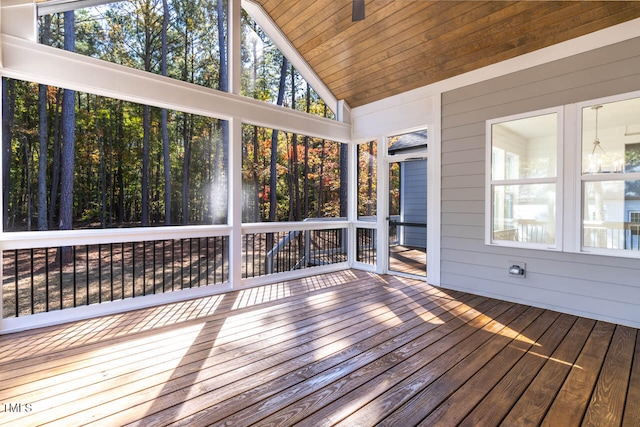 unfurnished sunroom with lofted ceiling and wood ceiling