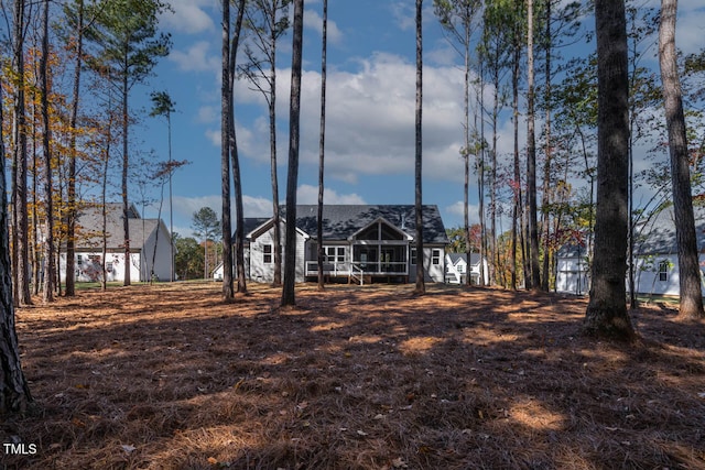 view of front of house featuring a sunroom