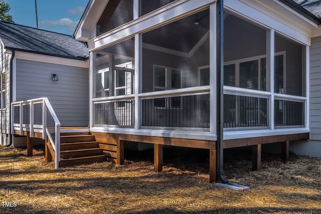 view of side of property with a sunroom