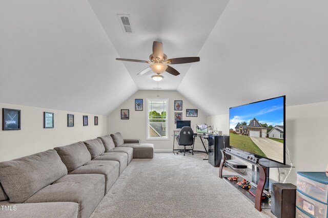 carpeted living room with ceiling fan and lofted ceiling