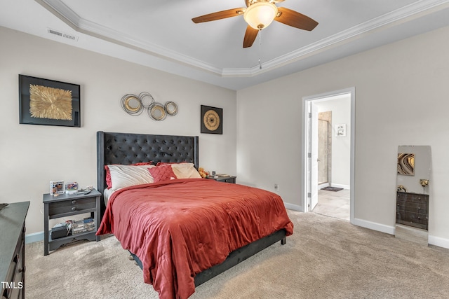 bedroom featuring ceiling fan, ornamental molding, light colored carpet, and a raised ceiling