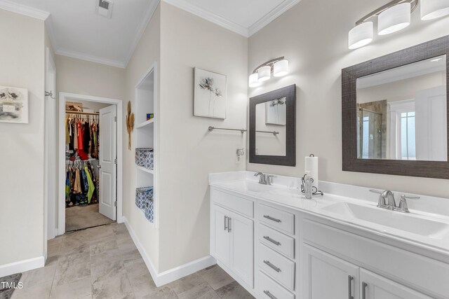 bathroom featuring dual vanity, tile patterned floors, and ornamental molding