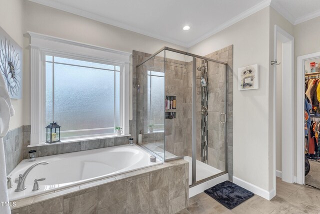 bathroom with tile patterned floors, crown molding, and separate shower and tub