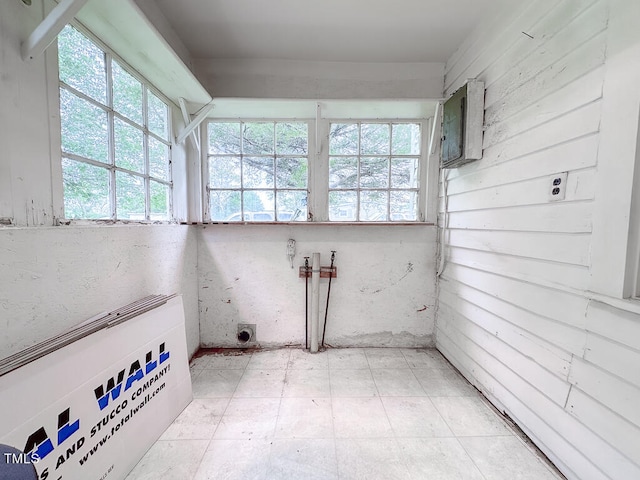 unfurnished sunroom featuring electric panel