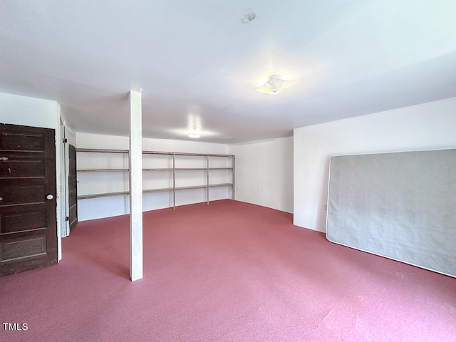 basement featuring carpet flooring