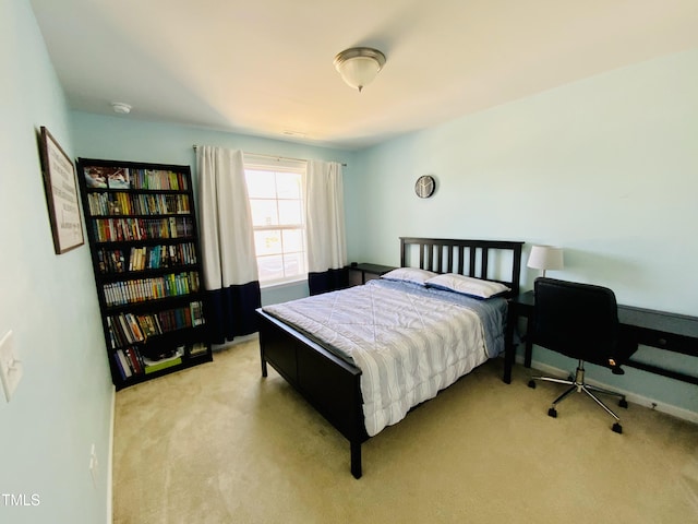 bedroom featuring light colored carpet