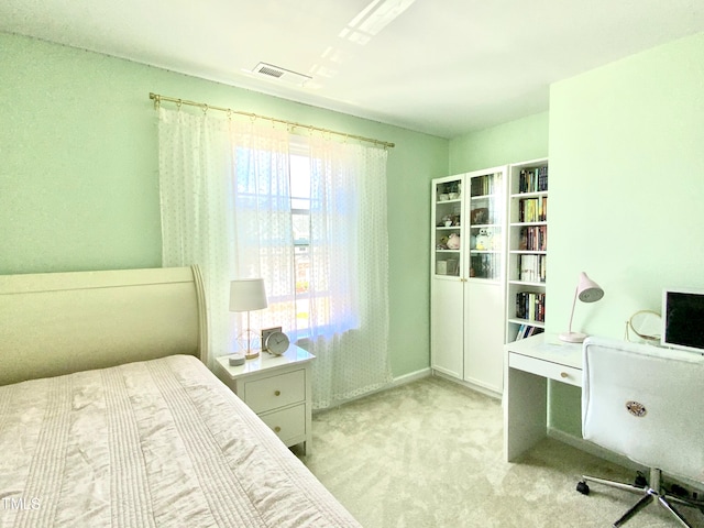 bedroom with light carpet