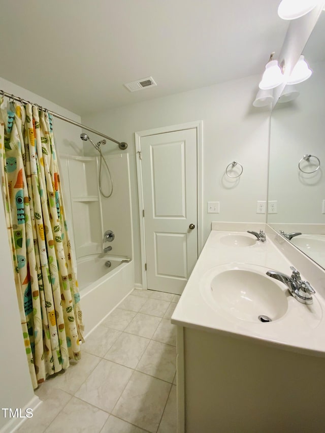 bathroom featuring tile patterned flooring, vanity, and shower / bath combination with curtain