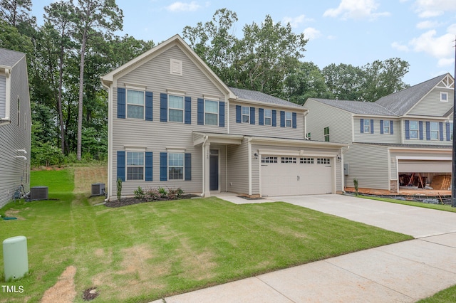 view of front of house featuring central AC unit, a garage, and a front yard