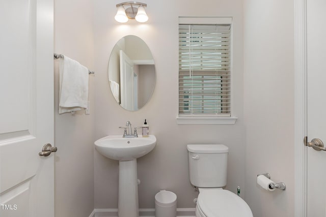 bathroom featuring toilet and a sink