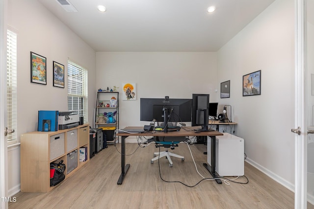 office with light wood-style floors, visible vents, baseboards, and recessed lighting