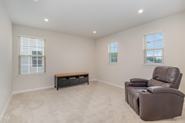 sitting room featuring baseboards, carpet flooring, and recessed lighting