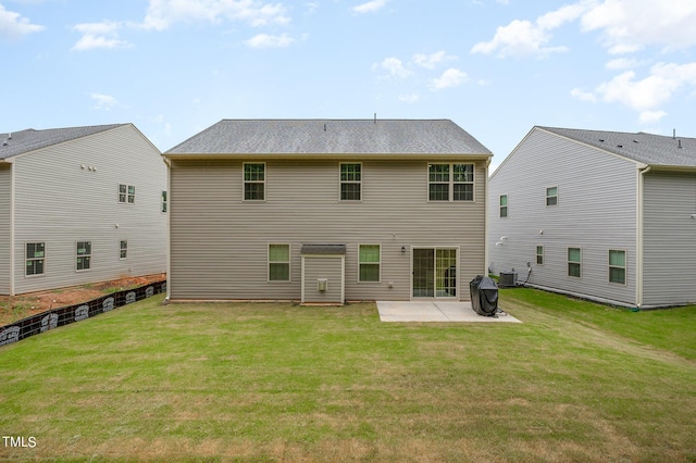 back of property with cooling unit, a patio area, and a lawn