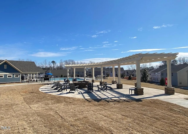 view of property's community with a patio, a swimming pool, and a pergola