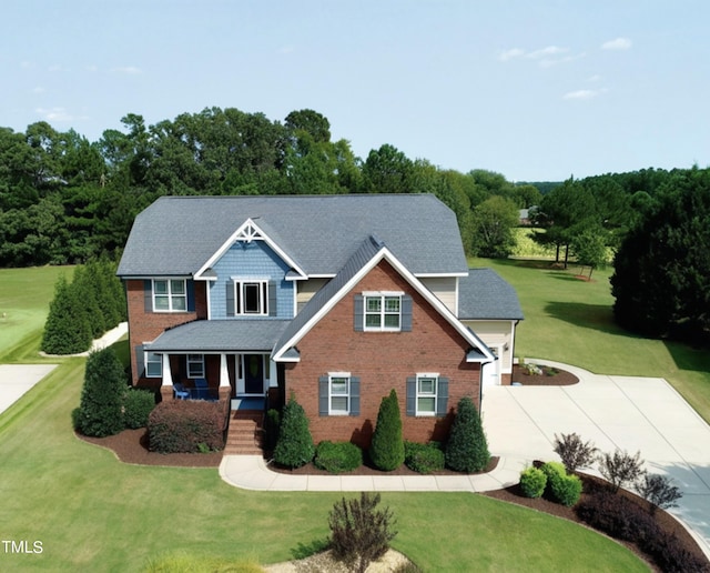 view of front of house featuring a front yard and covered porch