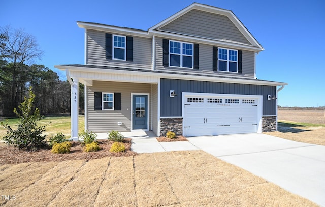 view of front of house with a garage and a porch