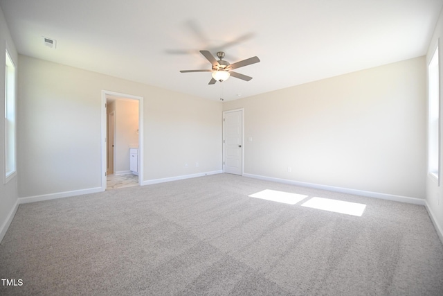 unfurnished room featuring light colored carpet and ceiling fan