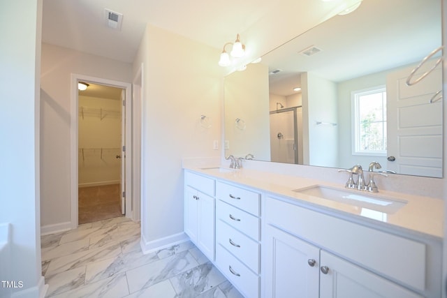 bathroom with vanity and an enclosed shower