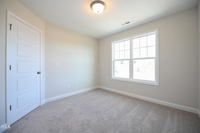 unfurnished room with carpet floors