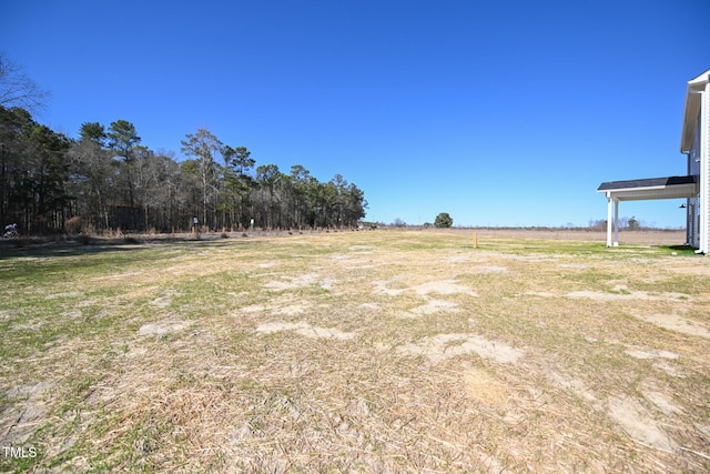 view of yard with a rural view