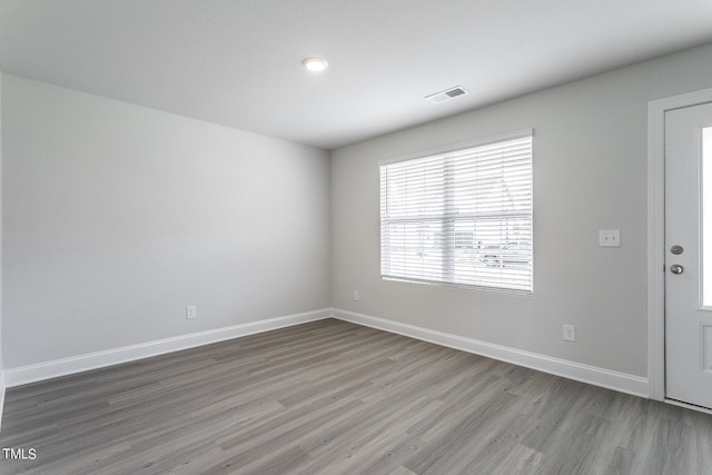 empty room with wood-type flooring