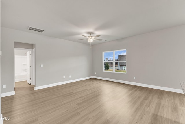 unfurnished room featuring ceiling fan and light wood-type flooring