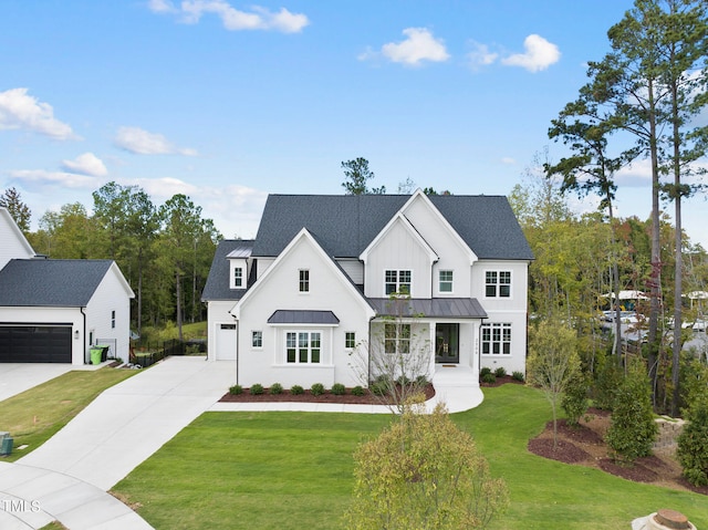 modern farmhouse with a garage and a front lawn