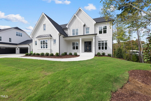 view of front facade with a garage and a front lawn